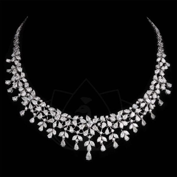 Breathtaking stunner diamond necklace with solitaire fancy shape diamonds.