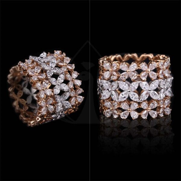 Stylish chic diamond ring with pear shape diamonds in white and rose gold.