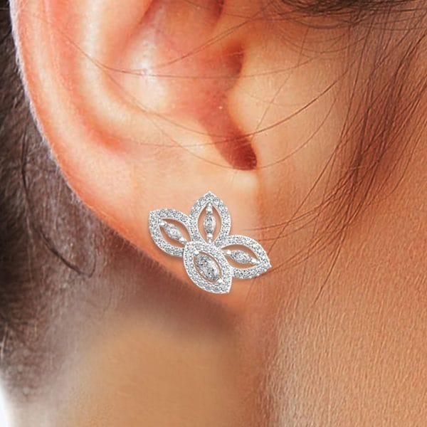 Human wearing the 0.15 Ct Benevolent Blossoms Studs Earrings In White Gold For Women(Halo)