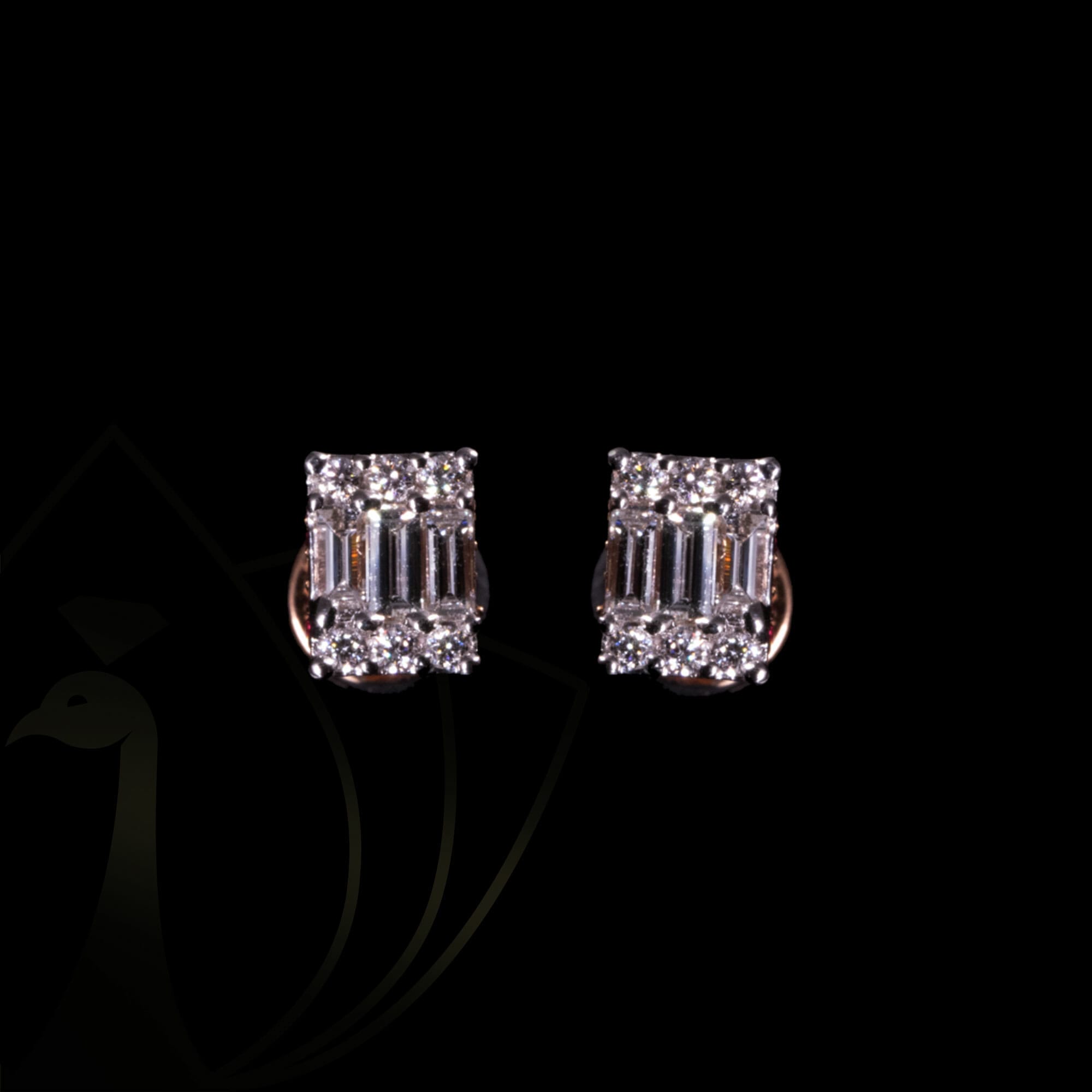 A pair of imperial empress emerald cut diamond earrings.