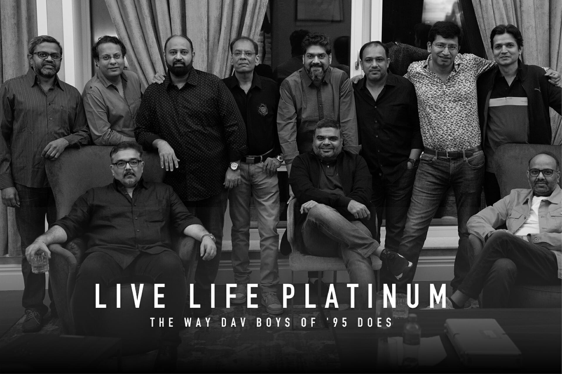 A black and white banner of gentlemen posing for the Platinum collection 