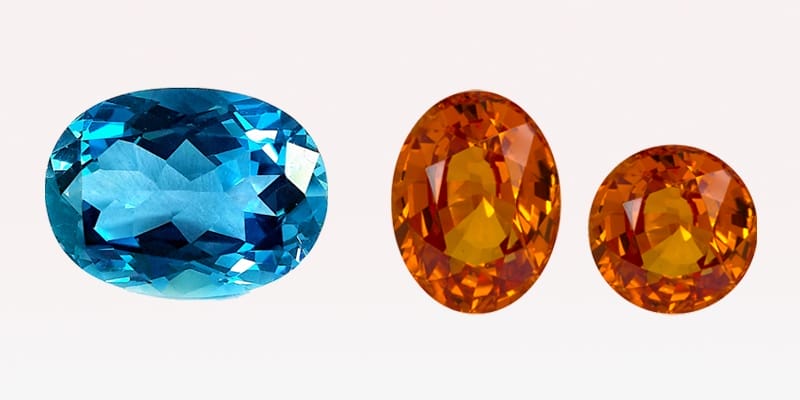 Stunning Golden Allure The November bithstones - yellow citrine gemstones and the blue oval shape Topaz.