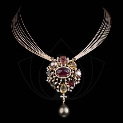 The Colourful Bliss Diamond Pendant studded with garnet gemstones and pearls from Khwaahish.